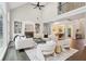 Open living room featuring a fireplace, built-in shelving, and access to the dining area at 434 Westlake Nw Dr, Marietta, GA 30064