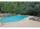 Large outdoor pool with lounge chairs and greenery surround at 434 Westlake Nw Dr, Marietta, GA 30064