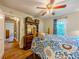 Bedroom featuring hardwood floors, a ceiling fan and a patterned bedspread at 5130 Dearing St, Covington, GA 30014
