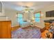 Comfortable bedroom featuring natural light, a ceiling fan, and hardwood floors at 5130 Dearing St, Covington, GA 30014