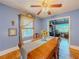 Dining room with blue walls and hardwood floors plus a dining table at 5130 Dearing St, Covington, GA 30014