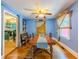 Dining room with blue walls and hardwood floors plus a dining table at 5130 Dearing St, Covington, GA 30014