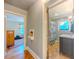 Hallway view to bathroom and bedroom with natural light at 5130 Dearing St, Covington, GA 30014