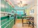 A cheerful kitchen features painted cabinets, stainless appliances, and an eat-in table at 5130 Dearing St, Covington, GA 30014