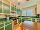 Cozy kitchen with painted cabinets, tile countertops, and stainless steel range at 5130 Dearing St, Covington, GA 30014