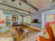 Cozy living room with wood-burning stove, exposed beams and natural light at 5130 Dearing St, Covington, GA 30014