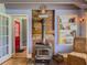 Close-up of a rustic wood-burning stove with brick surround, and built-in shelves at 5130 Dearing St, Covington, GA 30014