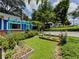 Landscaped yard with garden beds, green lawn and shrubbery next to the home at 5130 Dearing St, Covington, GA 30014
