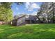 Spacious backyard with a modern home and a lush green lawn perfect for outdoor activities and relaxation at 600 Applewood Nw Ln, Marietta, GA 30064