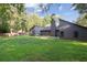 Expansive backyard with lush green grass and modern home architecture, perfect for outdoor living and entertaining at 600 Applewood Nw Ln, Marietta, GA 30064