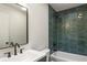 Stylish bathroom featuring a tub and shower combination with tile surround, a modern vanity, and a sleek mirror at 600 Applewood Nw Ln, Marietta, GA 30064