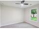 Bedroom features carpet flooring, a modern ceiling light, and a large window, creating a comfortable atmosphere at 600 Applewood Nw Ln, Marietta, GA 30064