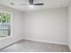 The bedroom features carpet flooring, a modern ceiling light, and a large window, creating a cozy and inviting atmosphere at 600 Applewood Nw Ln, Marietta, GA 30064