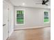 Bright bedroom features hardwood flooring, recessed lighting, a ceiling fan, and two windows enhancing the room's appeal at 600 Applewood Nw Ln, Marietta, GA 30064
