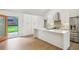 Modern kitchen featuring stainless steel appliances, sleek cabinetry, island, and seamless access to the backyard at 600 Applewood Nw Ln, Marietta, GA 30064