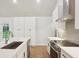 Modern kitchen boasts stainless appliances, sleek countertops, and abundant cabinetry for ample storage at 600 Applewood Nw Ln, Marietta, GA 30064