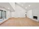 Vaulted living area with hardwood floors, fireplace, and abundant natural light from large windows; bright and airy at 600 Applewood Nw Ln, Marietta, GA 30064