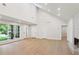 Open living area featuring light wood floors, a modern fireplace, and a large window with natural light at 600 Applewood Nw Ln, Marietta, GA 30064
