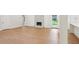 Spacious living room with hardwood floors, fireplace, and connection to the kitchen and backyard access at 600 Applewood Nw Ln, Marietta, GA 30064