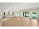 Spacious living room featuring light wood floors, high ceilings, an open layout, and a modern kitchen at 600 Applewood Nw Ln, Marietta, GA 30064
