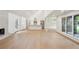 Open-concept living area with light wood floors, a modern fireplace, and a bright, airy feel at 600 Applewood Nw Ln, Marietta, GA 30064