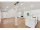 Open-concept living area with hardwood floors, fireplace, and seamless integration with modern kitchen space at 600 Applewood Nw Ln, Marietta, GA 30064