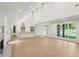 Bright, open-concept living space with high ceilings, light wood floors, and a modern kitchen at 600 Applewood Nw Ln, Marietta, GA 30064
