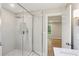 Modern bathroom features an open glass shower with a rain shower head enhancing its spa-like feel and contemporary design at 600 Applewood Nw Ln, Marietta, GA 30064
