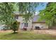 Home exterior showing a quaint backyard with a patio, surrounded by lush trees at 179 Parkside Dr, Stockbridge, GA 30281