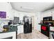 Functional kitchen with white cabinets, modern appliances, and checkered backsplash at 179 Parkside Dr, Stockbridge, GA 30281