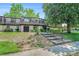 Condo with mature landscaping and stairs leading up to the front entrance for a pleasant curb appeal at 50 Le Parc Fontaine, Lithonia, GA 30038