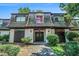 Charming condo featuring unique architectural details and a welcoming front entrance and mature landscaping at 50 Le Parc Fontaine, Lithonia, GA 30038