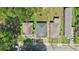 Overhead drone perspective of uniform rooftops of multiple homes along street with neat landscaping on a sunny day at 524 Paines Nw Ave, Atlanta, GA 30318