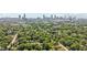Beautiful aerial neighborhood shot overlooking mature trees with the Atlanta skyline and Mercedes-Benz Stadium at 524 Paines Nw Ave, Atlanta, GA 30318