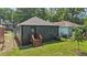 Lush backyard featuring green grass, a small tree, and a charming home exterior at 524 Paines Nw Ave, Atlanta, GA 30318