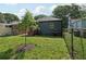 Lush backyard with a newly planted tree and green grass, offering a serene outdoor retreat at 524 Paines Nw Ave, Atlanta, GA 30318
