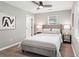 A calming bedroom features a ceiling fan, neutral colors, and an abstract art piece at 524 Paines Nw Ave, Atlanta, GA 30318