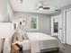 Bedroom features neutral walls, plush bedding, a ceiling fan, and bright windows at 524 Paines Nw Ave, Atlanta, GA 30318