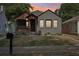 Charming bungalow with a covered front porch, dark gray paint, new windows, and a freshly landscaped front yard at 524 Paines Nw Ave, Atlanta, GA 30318