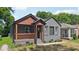 Charming gray brick bungalow with a covered front porch and well-maintained landscaping at 524 Paines Nw Ave, Atlanta, GA 30318