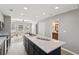 Modern kitchen with island, marble countertops, stainless appliances, and open to the living area at 524 Paines Nw Ave, Atlanta, GA 30318