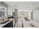 Bright, updated kitchen boasts an island with marble countertops and modern stainless steel appliances at 524 Paines Nw Ave, Atlanta, GA 30318