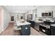 Bright, updated kitchen boasts an island with marble countertops and modern stainless steel appliances at 524 Paines Nw Ave, Atlanta, GA 30318