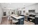 Stylish open-concept kitchen with stainless steel appliances, a large island, and modern cabinetry at 524 Paines Nw Ave, Atlanta, GA 30318