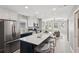 Bright, updated kitchen boasts an island with marble countertops and modern stainless steel appliances at 524 Paines Nw Ave, Atlanta, GA 30318