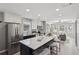 Bright, updated kitchen boasts an island with marble countertops and modern stainless steel appliances at 524 Paines Nw Ave, Atlanta, GA 30318