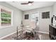 Inviting home office space featuring a modern glass desk, decor, and natural light at 524 Paines Nw Ave, Atlanta, GA 30318
