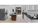 Modern kitchen with stainless steel appliances, granite countertops, and stylish backsplash tiles at 980 Porter Rd, Decatur, GA 30032