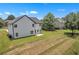 Exterior view of home showcasing large backyard and patio, perfect for outdoor entertaining at 1128 E Shoreview Rd, Mcdonough, GA 30253