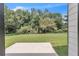 A patio overlooks a large backyard with many trees providing shade and tranquility at 1128 E Shoreview Rd, Mcdonough, GA 30253